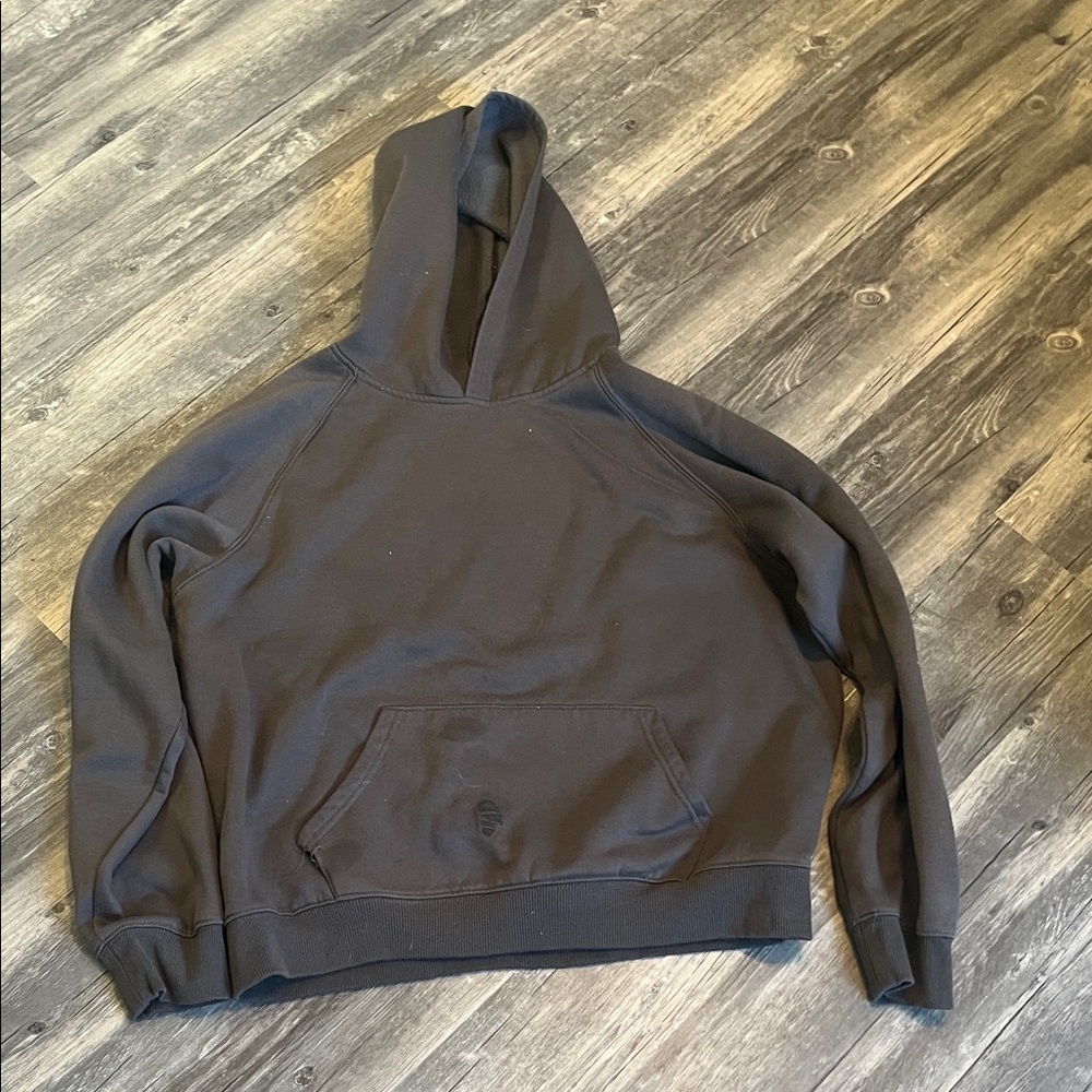Woman’s gray hoodie with stain